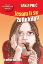 A girl with the long brown hair is thoughtfully nibbling a piece of chocolate.