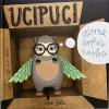 Ucipuci the Owl is looking out of the box